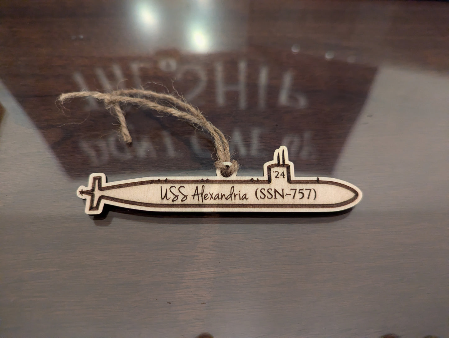 4 by 1.5 inch baltic birch wood ornament with barn yard string of a LA class submarine for the USS Alexandria (SSN-757) with the year marker of '24 on the sail.